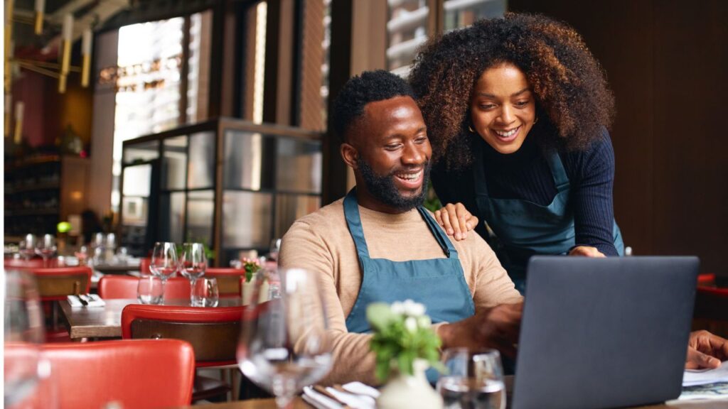 A couple running a restuarant that has a business emergency fund.