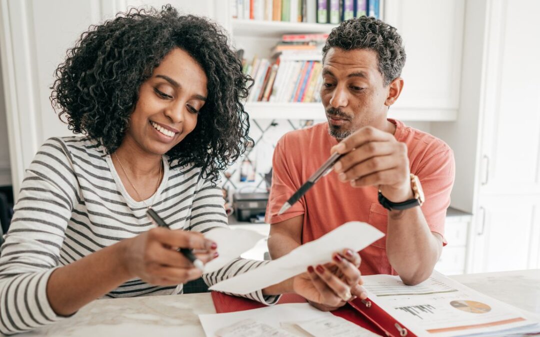 A couple reviewing the tax moves they can make before the end of the year.